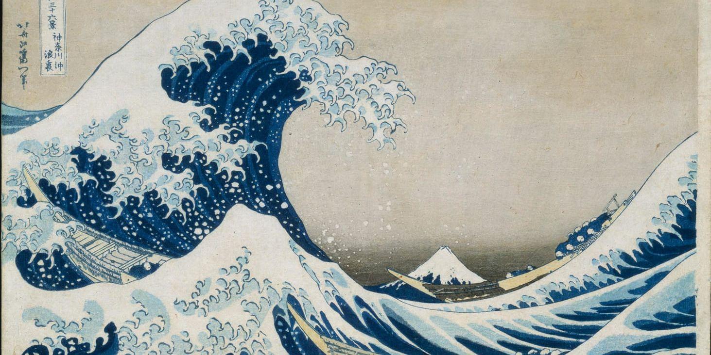 Konstverket "Under vågen utanför Kanagawa" ur serien "36 vyer av berget Fuji" av den japanske konstnären Katsushika Hokusai. Arkivbild.