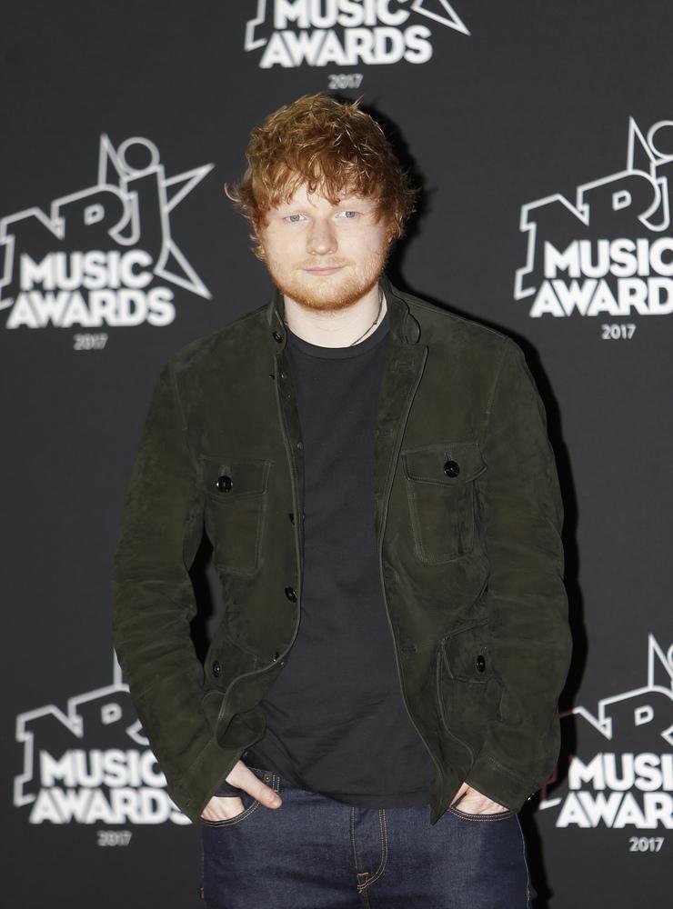 British singer songwriter Ed Sheeran arrives at the Cannes festival palace, to take part in the NRJ Music awards ceremony, Saturday, Nov. 4, 2017, in Cannes, southeastern France. (AP Photo/Claude Paris)