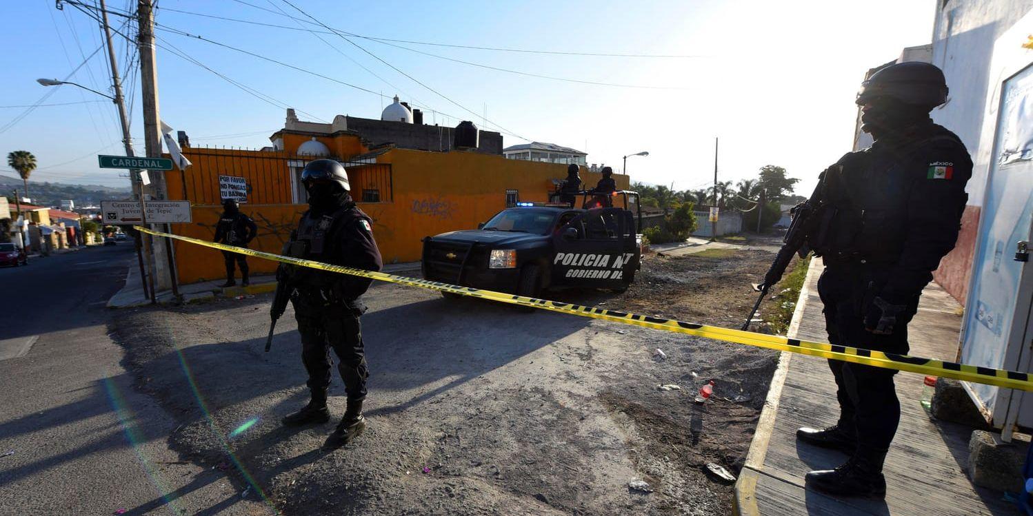 Polis i Mexiko efter en skottlossning där kriminella gäng var inblandade. Arkivbild.