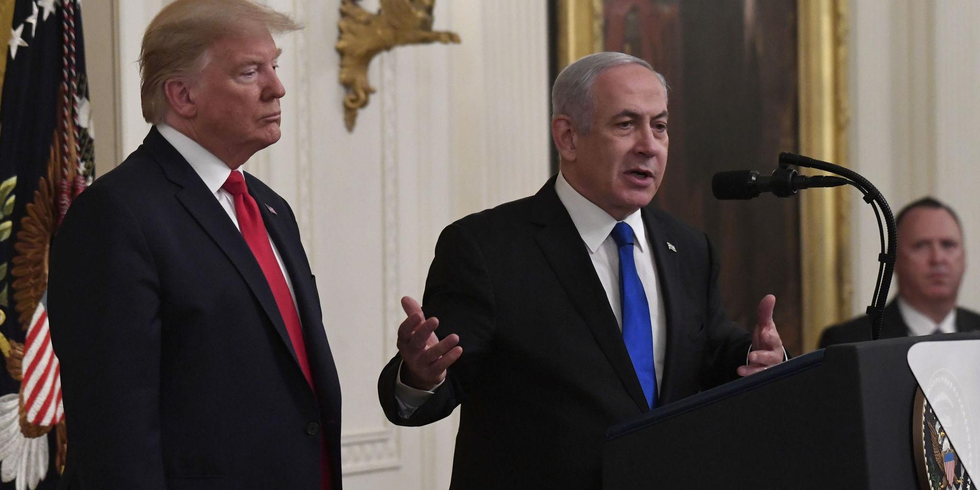 President Donald Trump, left, listens as Israeli Prime Minister Benjamin Netanyahu, right, speaks during an event in the East Room of the White House in Washington, Tuesday, Jan. 28, 2020, to announce the Trump administration&apos;s much-anticipated plan to resolve the Israeli-Palestinian conflict. (AP Photo/Susan Walsh)  DCSW116