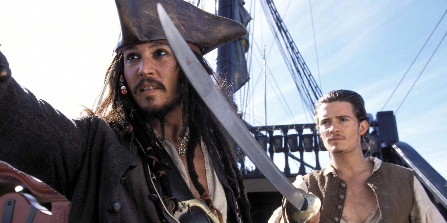 Johnny Depp som Jack Sparrow tillsammans med Orlando Blooms rollfigur Will Turner i "Pirates of the Caribbean". Arkivbild.