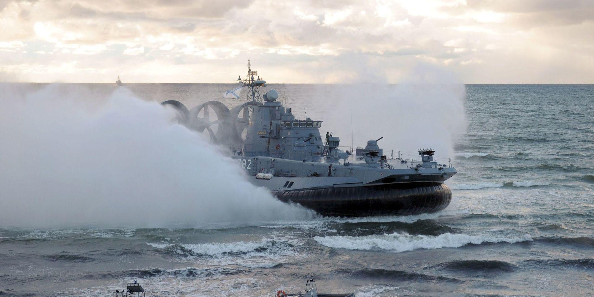 A military hovercraft approaches shore during the Russian-Belarusian West-2013 joint war games at the Khmelevka shooting range in Kaliningrad region, western Russia, Thursday, Sept. 26, 2013. Russian President Vladimir Putin and Belarusian President Alexander Lukashenko watched the joint war games on Thursday. (AP Photo/RIA-Novosti, Alexei Druzhinin, Presidential Press Service)