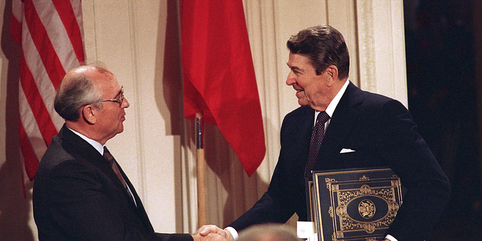 ** FILE ** U.S. President Ronald Reagan, right, shakes hands with Soviet leader Mikhail Gorbachev after the two leaders signed the Intermediate Range Nuclear Forces Treaty to eliminate intermediate-range missiles during a ceremony in the White House East Room in Washington, D.C., in this Tuesday, Dec. 8, 1987 file photo.  Speaking on a U.S. proposal to base a missile shield in Poland and the Czech Republic Russian missile forces chief Gen. Nikolai Solovtsov warned Monday Feb. 19, 2007 that the plan could prompt Moscow to target the former allies with its own missiles. Gen. Solovtsov said it would take only five, six years _ maybe less _ to build new, upgraded versions of Russian missiles scrapped under the INF Treaty.(AP Photo/Bob Daugherty, File)    