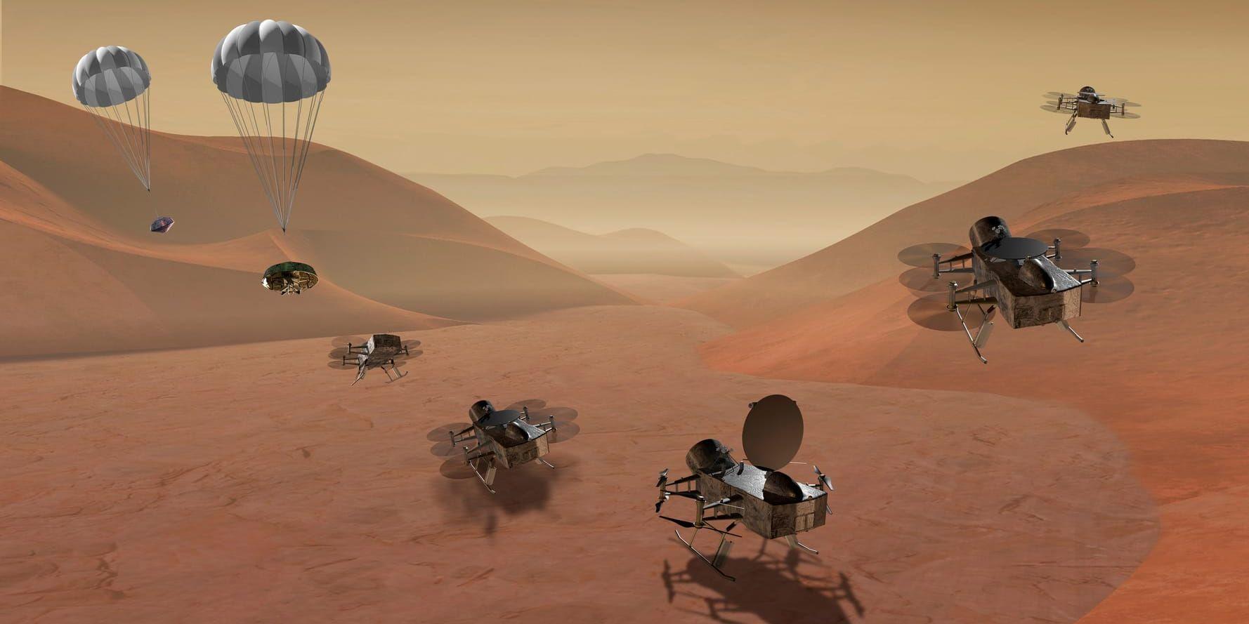 En illustration av hur Nasas drönarlika robot ska kunna landa och sedan flyga vidare på Titan. Bilden har tagits fram av en illustratör och distribuerats av Nasa.